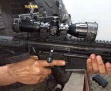 Arma com mira a laser é apreendida em embarcação
